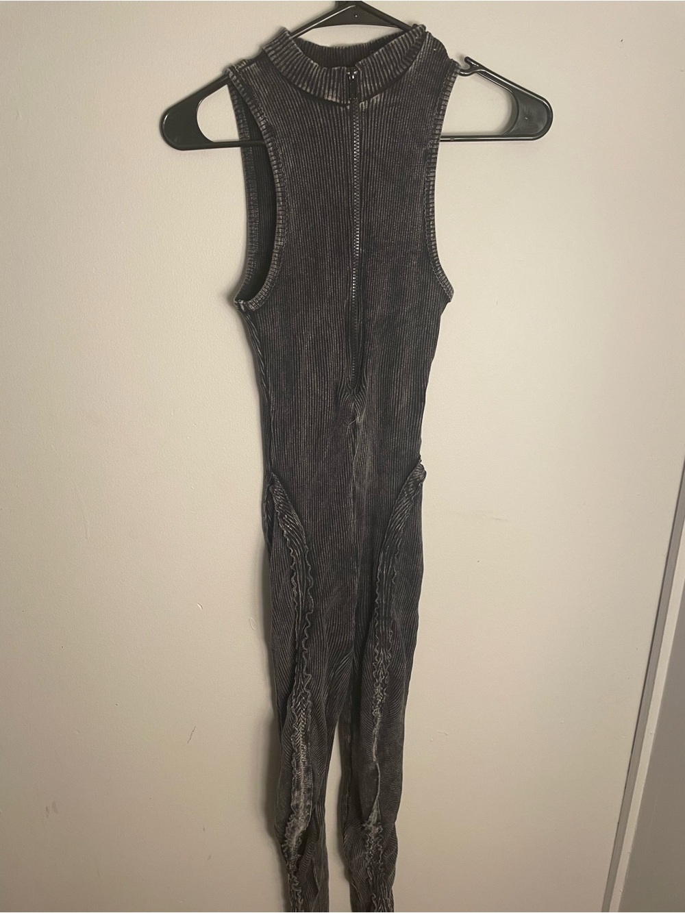 Sleeve less mineral wash ribbed jumpsuit, featuring a high neck front zipper